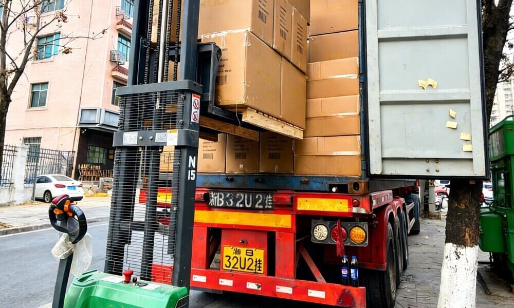 Fertilizer cargo being loaded into a shipping container